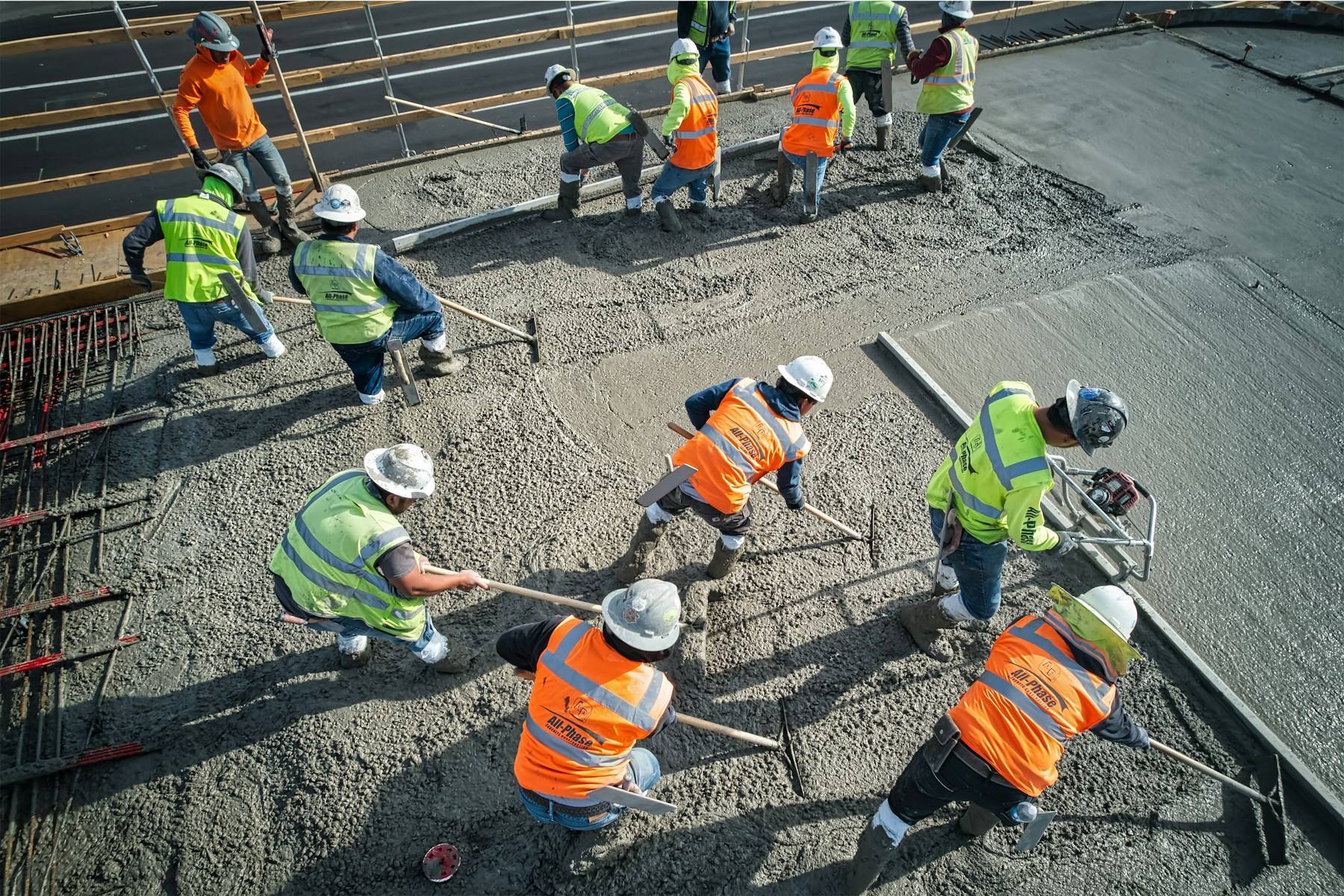 Site crew levelling a concrete slab